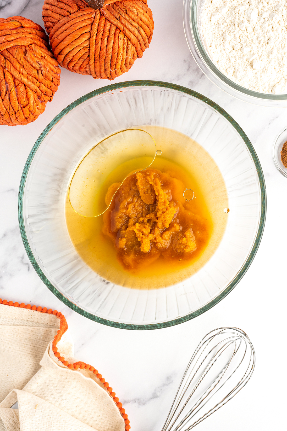 Wet ingredients for pumpkin churros in a bowl.