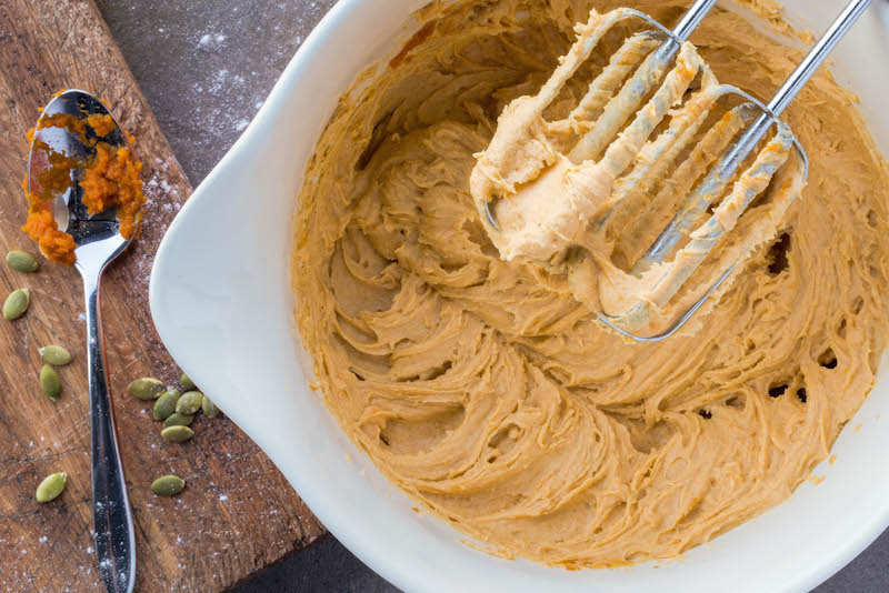 Pumpkin sheet cake batter with beaters. 