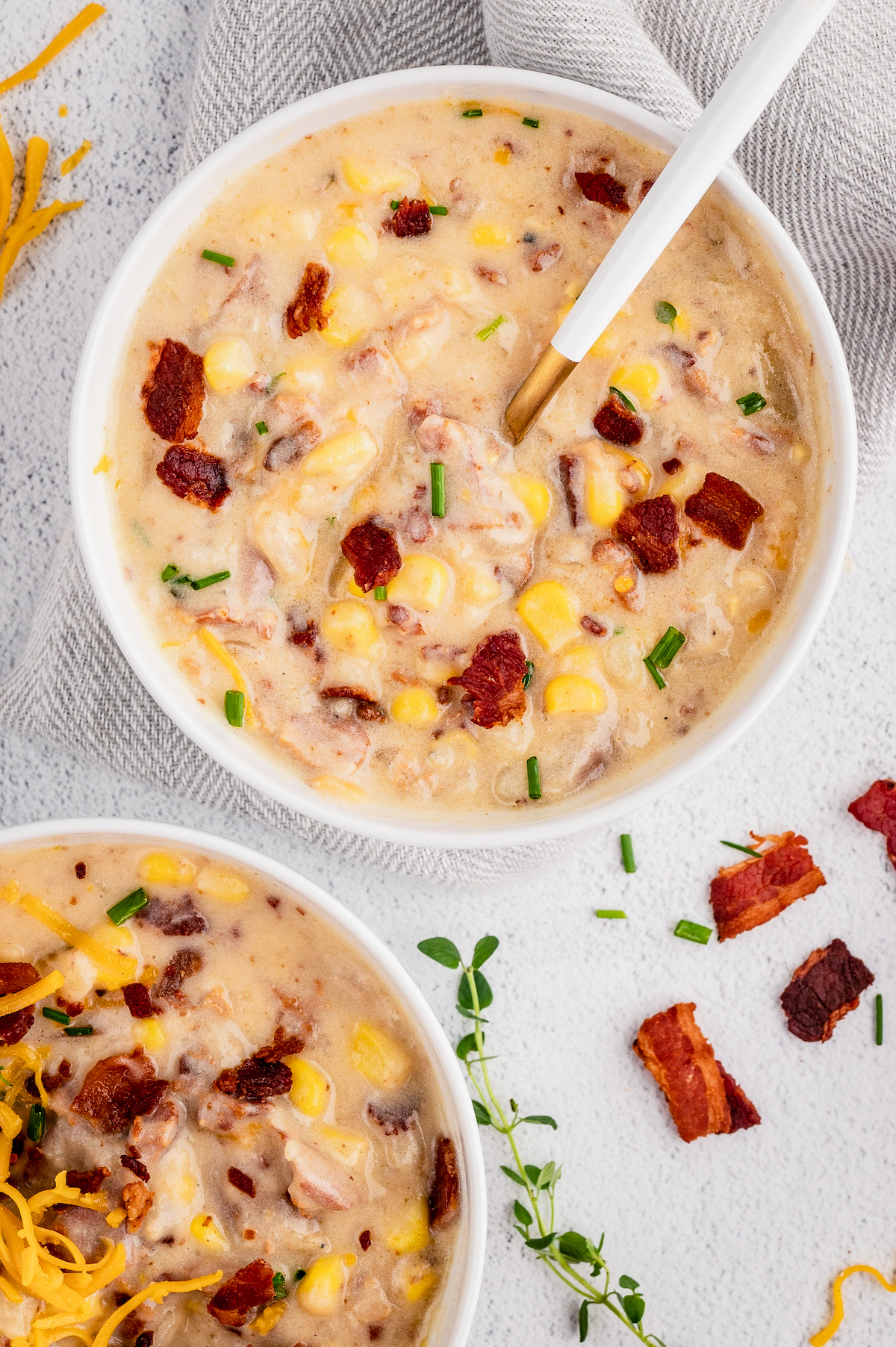 Two bowls of bacon corn chowder.