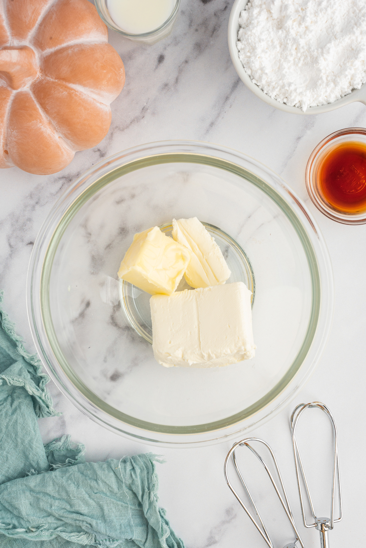 Ingredients for the cream cheese frosting in a bowl.