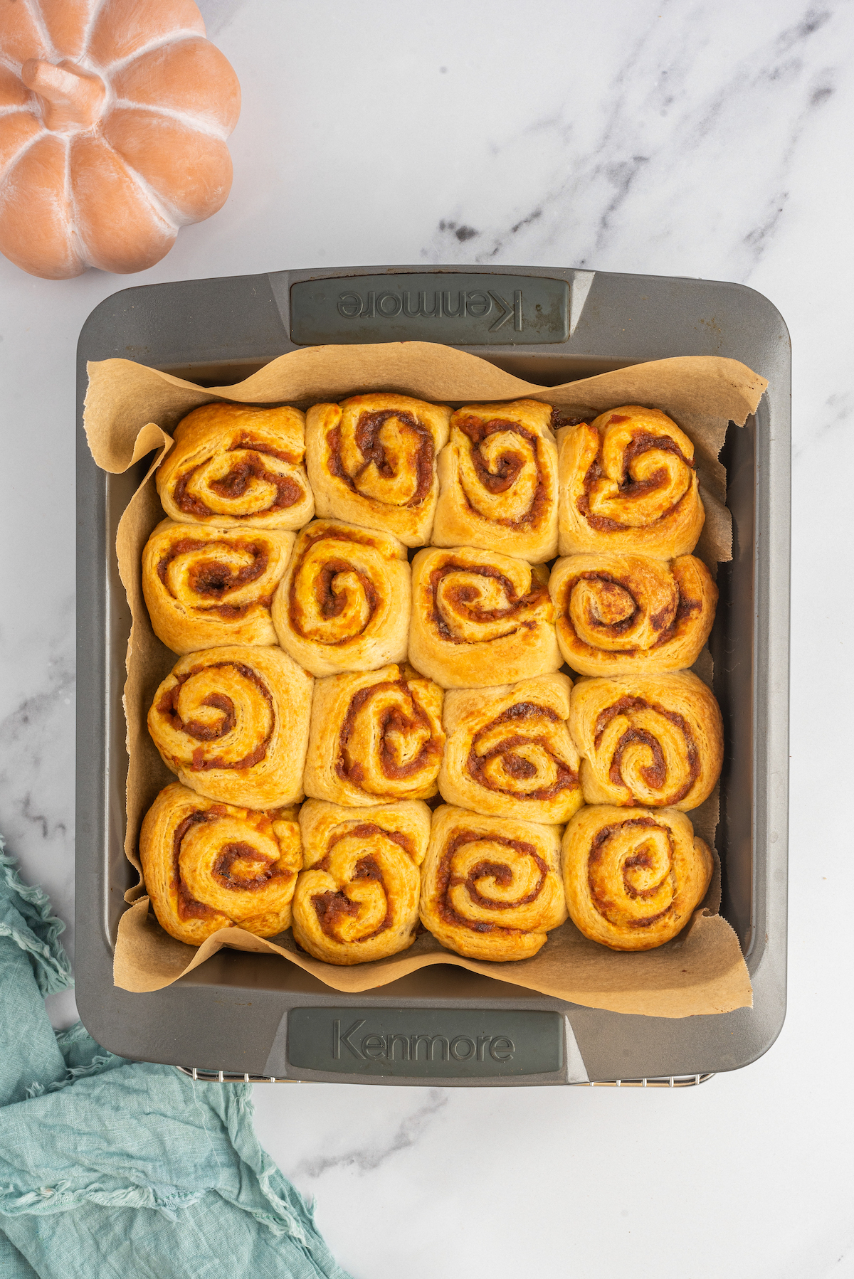 Unfrosted, baked pumpkin cinnamon rolls.