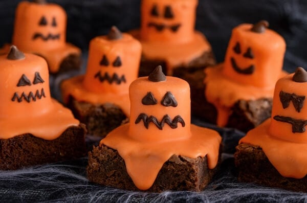 Seven Halloween Jack O' Lantern Brownies with Different Expressions on their Faces