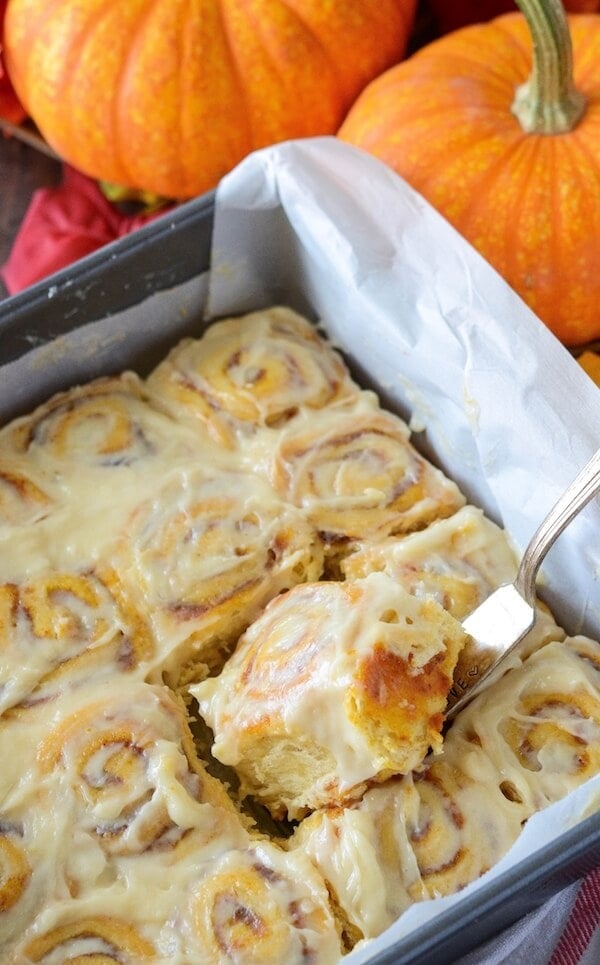Pumpkin Cinnamon Rolls made in just 30 minutes! Sweet pumpkin cinnamon rolls are made quickly with crescent dough and then covered in a delicious cream cheese frosting!