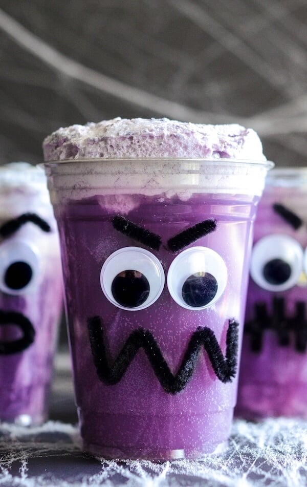 Purple People Eater Floats! Create this fun Halloween treat with the kids with pipe cleaners, hot glue, plastic cups, vanilla ice cream and purple grape soda!