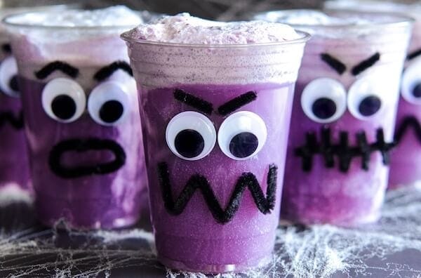 Purple People Eater Floats! Create this fun Halloween treat with the kids with pipe cleaners, hot glue, plastic cups, vanilla ice cream and purple grape soda!