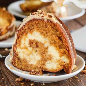 Sweet Potato Cream Cheese Bundt Cake: this rich, moist, sweet potato spiced cake is swirled with sweet cream cheese and topped with a pecan praline frosting. #Cake #BundtCake #SweetPotato #FallRecipes