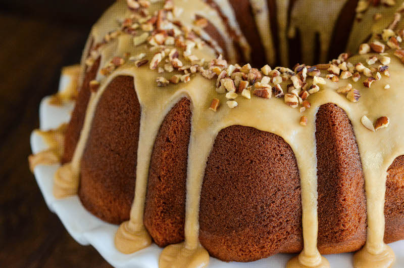 Sweet potato cream cheese bundt cake topped with praline frosting.