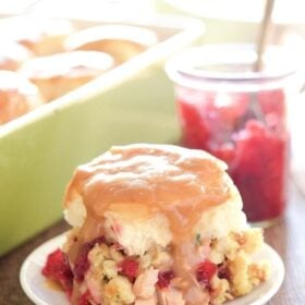 Baked Leftover Thanksgiving Turkey Sandwiches - these baked mini sandwiches are stuffed with leftover Thanksgiving turkey, smoked gouda cheese, cranberry relish and stuffing. Then they are topped with gravy and baked to perfection!