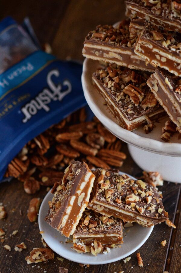 Pecan Caramel Bars on a white plate.