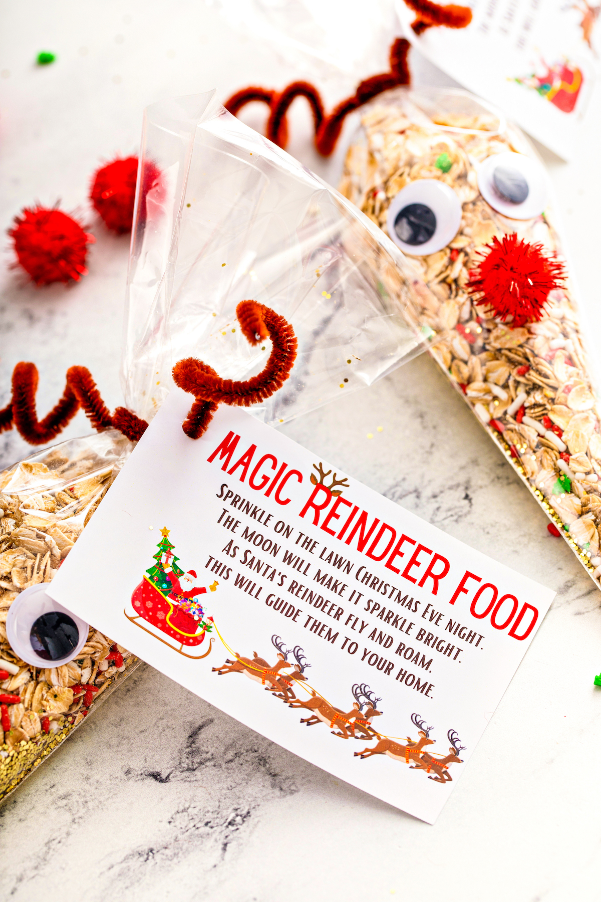 Decorated reindeer packets with a reindeer food printable attached.