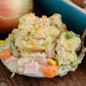 Turkey Biscuit Casserole - save your leftover turkey from Thanksgiving and make this comforting casserole! It is filled with turkey and veggies in a creamy white gravy, then topped with gorgeous gluten free chive and cheese biscuits!