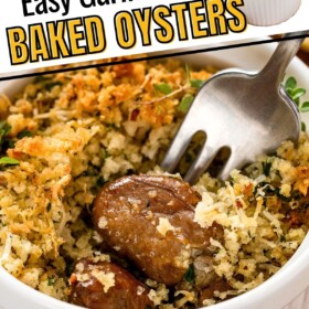 A fork is piercing a serving of baked oysters with lots of buttery breadcrumbs.