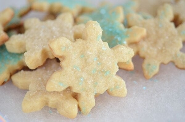 A pile of decorated Snowflake Cut Out Sugar Cookies
