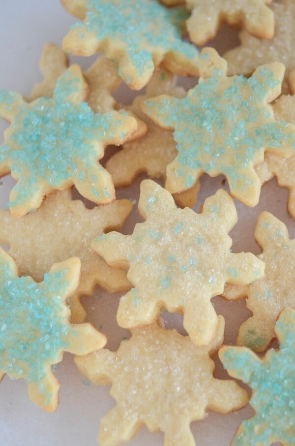 An assortment of blue and white-decorated Snowflake Cut Out Sugar Cookies
