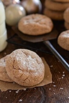 Stacks of spice cake mix cookies next to a glass of milk.