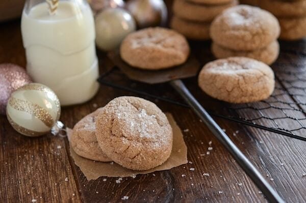 Stacks of spice cake mix cookies next to a glass of milk.