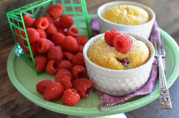 Warm Raspberry Pudding Cake with a vanilla butter sauce! It's a delicious easy way to impress your guests and no one would ever guess it started with a boxed cake mix!