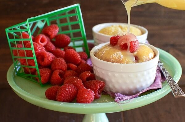 Warm Raspberry Pudding Cake with a vanilla butter sauce! It's a delicious easy way to impress your guests and no one would ever guess it started with a boxed cake mix!