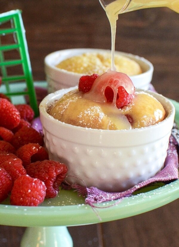Warm Raspberry Pudding Cake with a vanilla butter sauce! It's a delicious easy way to impress your guests and no one would ever guess it started with a boxed cake mix!