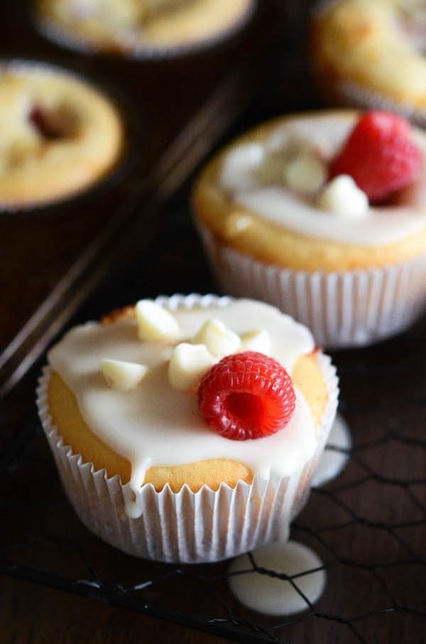 White Chocolate Raspberry Muffins - these easy one bowl muffins are filled with fresh raspberries, white chocolate chips and a hint of orange zest!