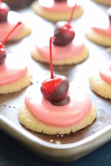 These cherry cookies are topped with cherry icing and cordial cherries.