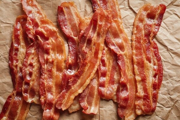 Crispy fried bacon on parchment paper