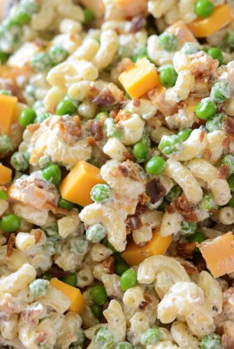Bacon Ranch Pasta Salad: a quick, easy and creamy pasta salad with cheddar cheese, bacon, peas and ranch seasoning all tossed together for a great potluck dish!