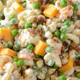 Bacon Ranch Pasta Salad: a quick, easy and creamy pasta salad with cheddar cheese, bacon, peas and ranch seasoning all tossed together for a great potluck dish!