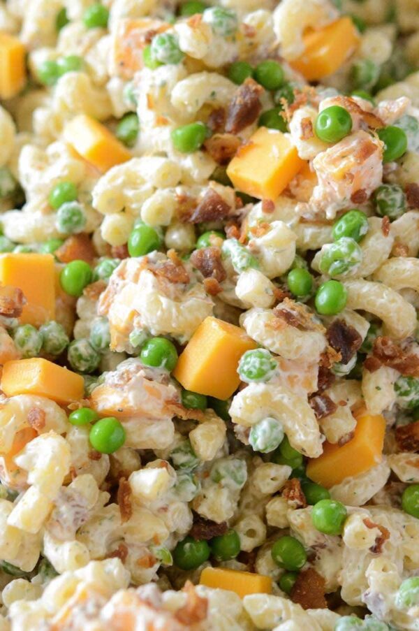 Up close image of bacon ranch pasta salad with cheese. 