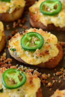 Jalapeño Popper Crostini! Buttery crostini toast topped with jalapeño popper dip and seasoned bread crumbs...then toasted till crispy perfection!