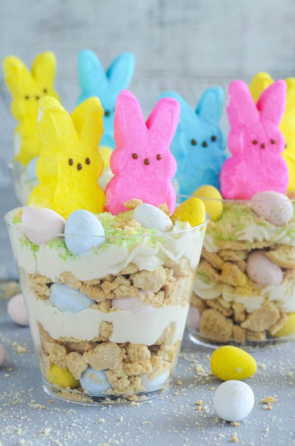 Oreo Easter Egg Cups are the perfect no bake Easter dessert with layers of crushed vanilla oreos, oreo cream filling buttercream, mini cadbury eggs and peeps!