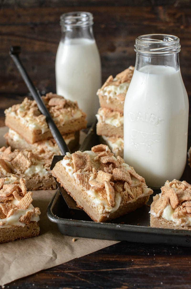 A Platter of French Toast Cookie Bars Among Two Glasses of Milk