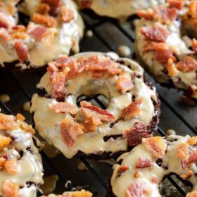 These maple bacon donuts are made with chocolate and topped with a sweet maple glaze and crispy bacon.