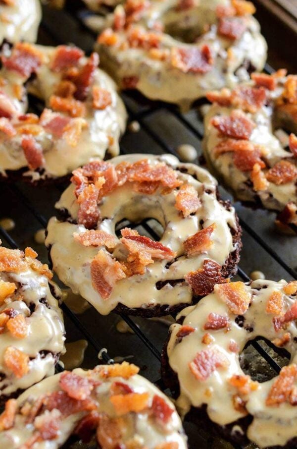 Chocolate Maple Bacon Donuts: old fashioned chocolate donuts, made extra tender with hidden yogurt, are fried and dunked in a maple glaze and topped with bacon!