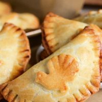 Creamy Turkey Hand Pies: warm flaky turnovers are stuffed with a delicious turkey filling made with herbs, gravy and onion and then baked until golden brown!