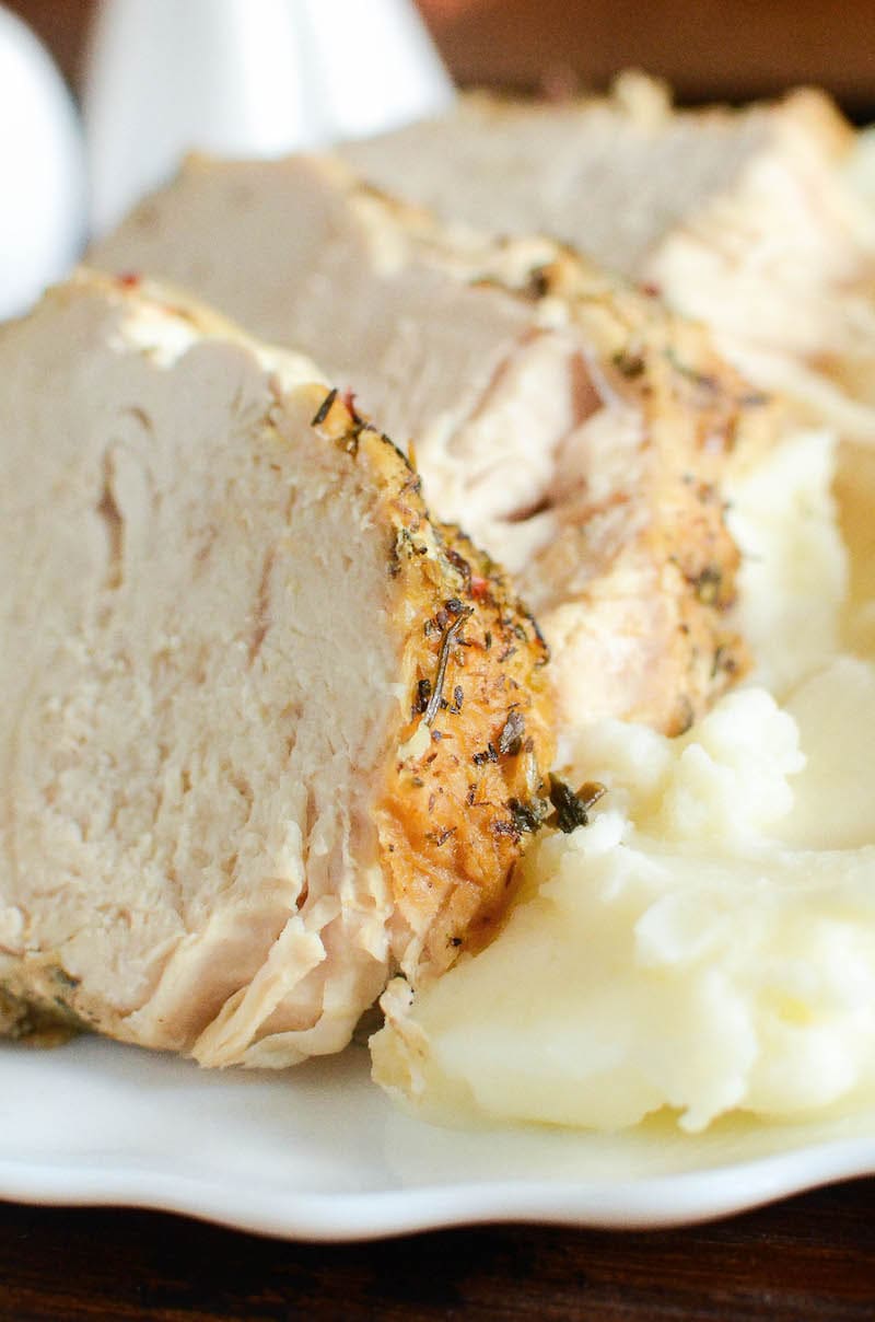 Instant Pot turkey on a plate with mashed potatoes