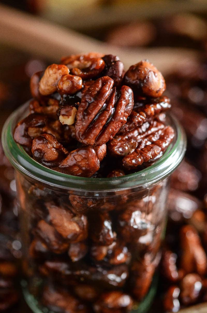 Pumpkin spice candied nuts in a glass jar.