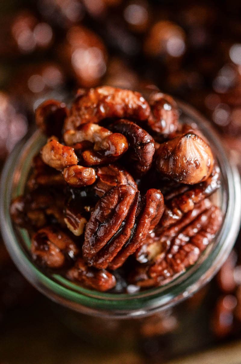 Top view of pumpkin spice candied nuts in a glass jar.