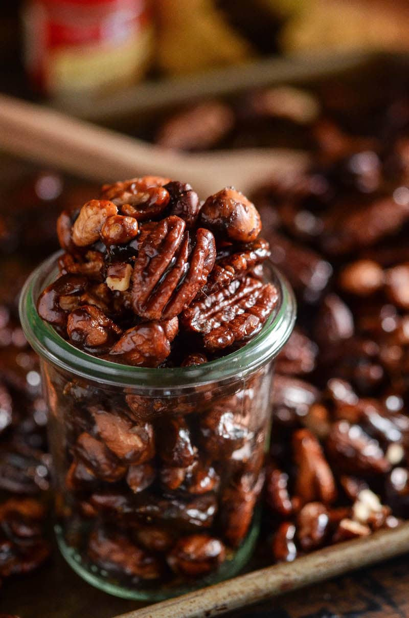 Pumpkin spice candied nuts in a glass jar.