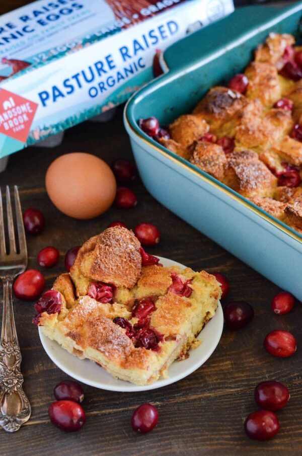 Cranberry Eggnog Bread Pudding: kick off the holidays with this rich bread pudding with cranberries, eggnog, cinnamon and a generous pour of buttery rum sauce!