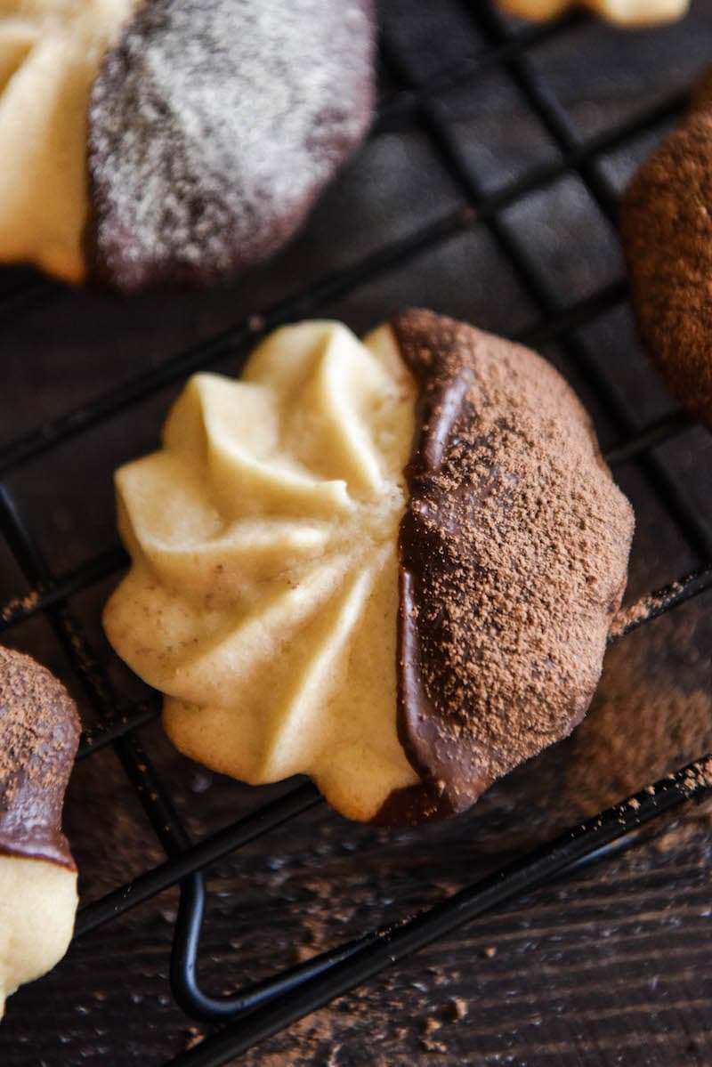 A Malted Shortbread Cookie Dipped in Dark Chocolate and Dusted with Cocoa Powder