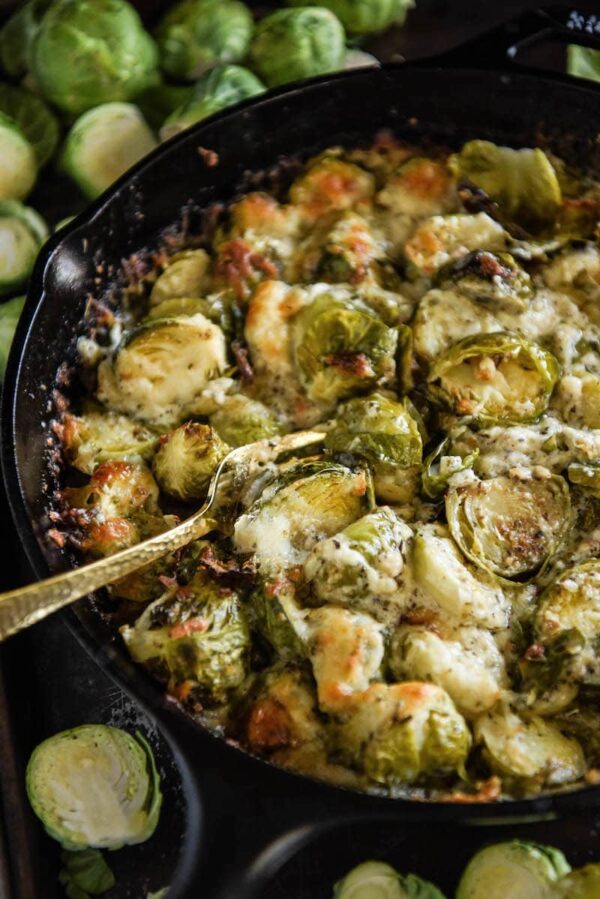Cheesy Baked Brussel Sprouts in a cast iron skillet. 