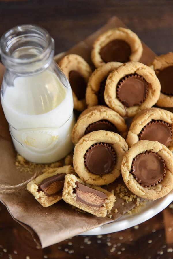 Peanut Butter Cookie Cups: soft homemade peanut butter cookie cups are baked in a mini muffin tin and then stuffed with chocolate Reese's peanut butter cups!