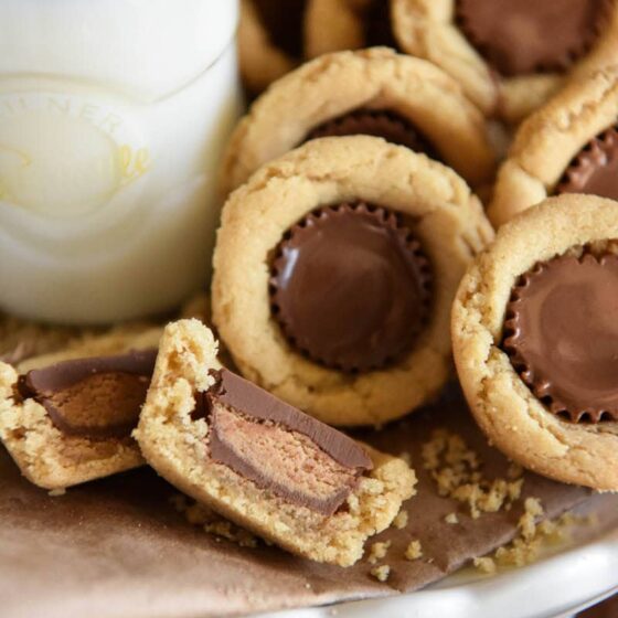 Peanut Butter Cookie Cups: soft homemade peanut butter cookie cups are baked in a mini muffin tin and then stuffed with chocolate Reese's peanut butter cups!