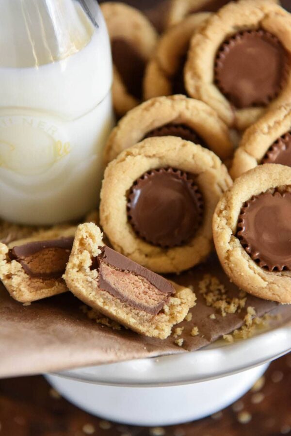 Peanut Butter Cookie Cups: soft homemade peanut butter cookie cups are baked in a mini muffin tin and then stuffed with chocolate Reese's peanut butter cups!