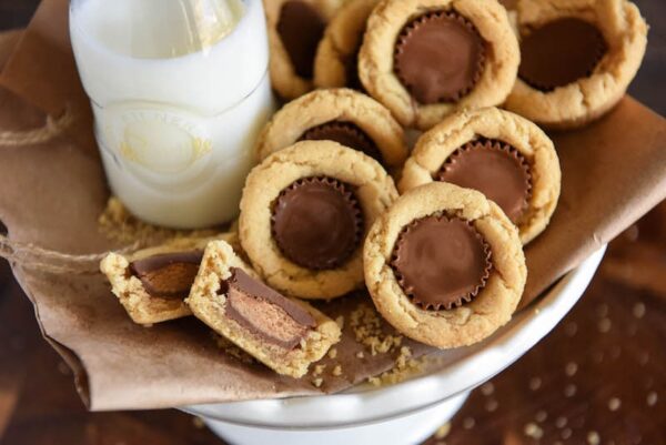 Peanut Butter Cookie Cups: soft homemade peanut butter cookie cups are baked in a mini muffin tin and then stuffed with chocolate Reese's peanut butter cups!