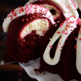 Red Velvet Cream Cheese Bundt Cake: this moist red velvet bundt cake is swirled with a sweet cream cheese filling and topped with a whipped cream cheese frosting!