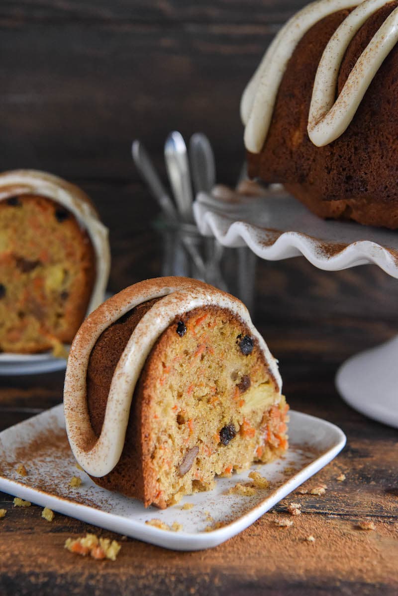 Two Bundt Cake Slices Drizzled with Cream Cheese Icing and Dusted with Ground Cinnamon