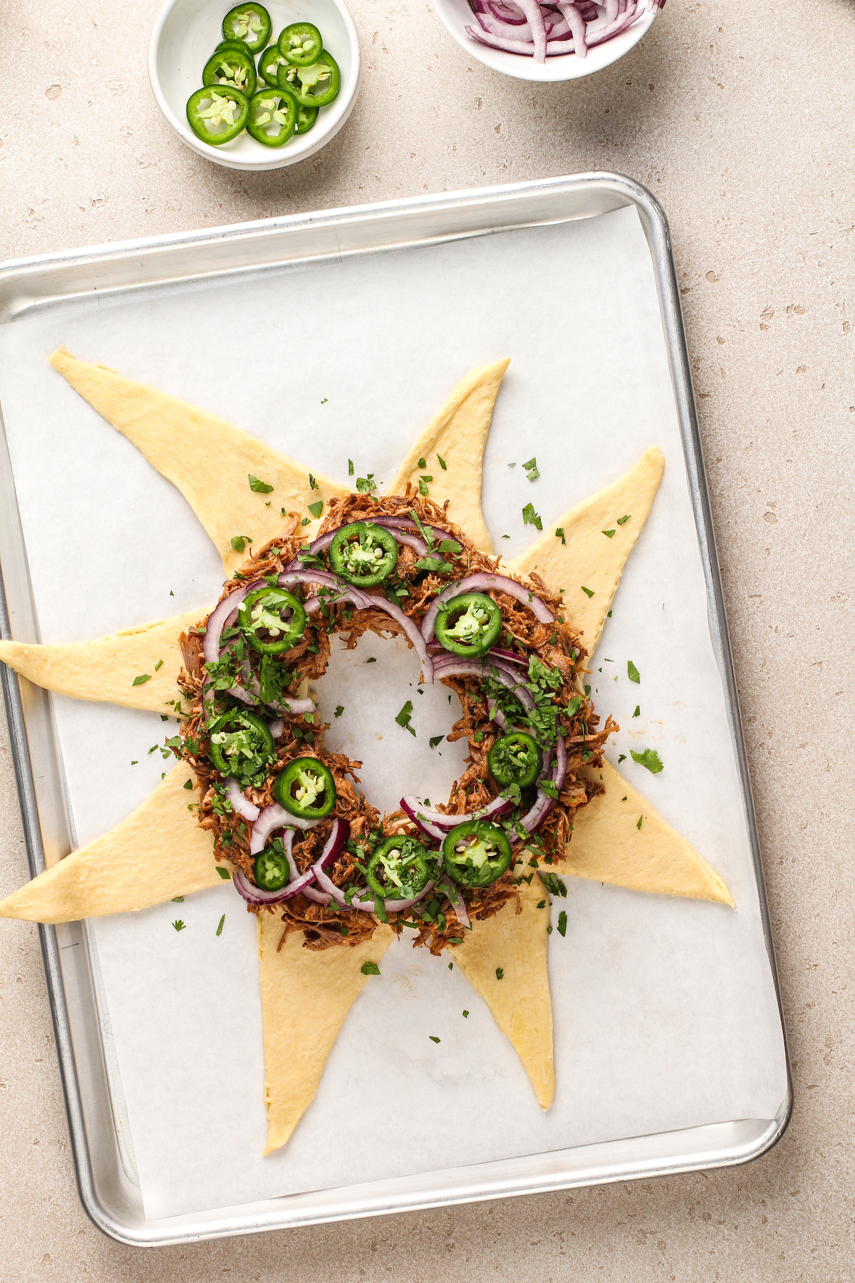 Adding the pulled pork, jalapeño, onion, and cilantro.