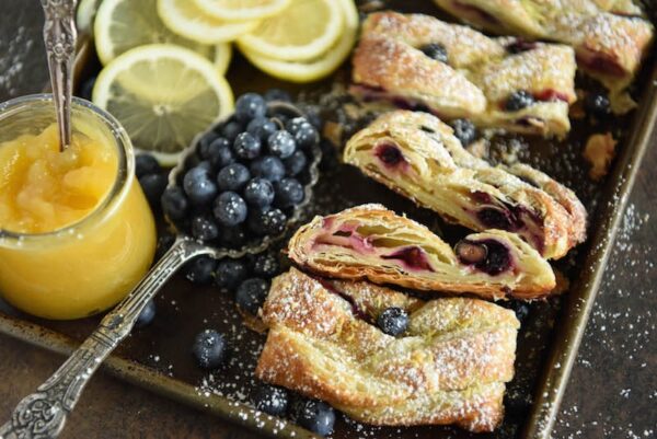 This flaky Blueberry Lemon Braid is filled with cream cheese, lemon curd and blueberries to create an amazing dessert. It is also perfect with coffee for breakfast.